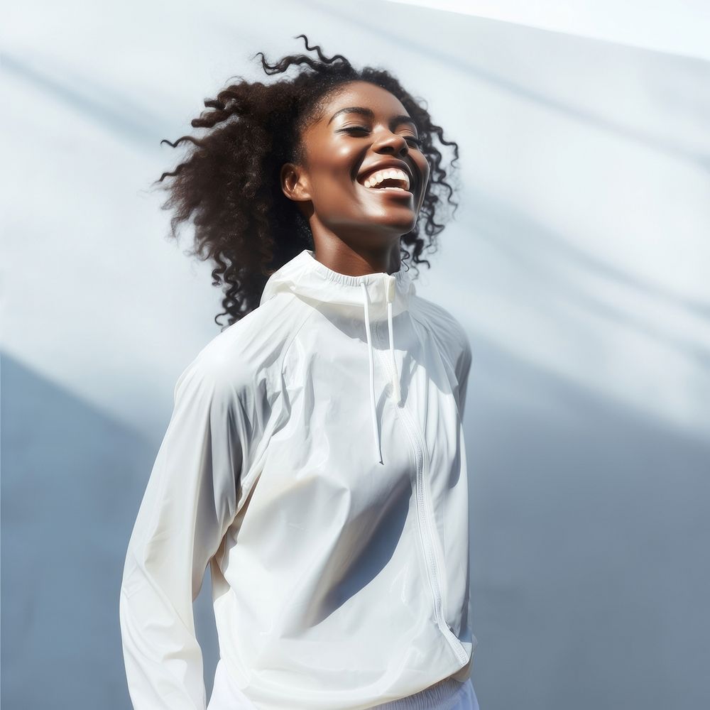 Black woman in white sport wear happy laughing person.