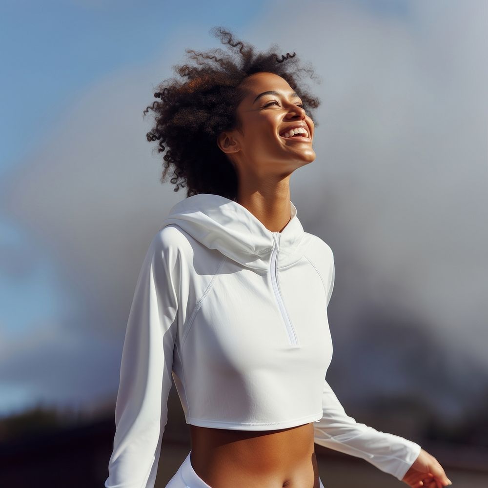 Black woman in white sport wear happy laughing person.