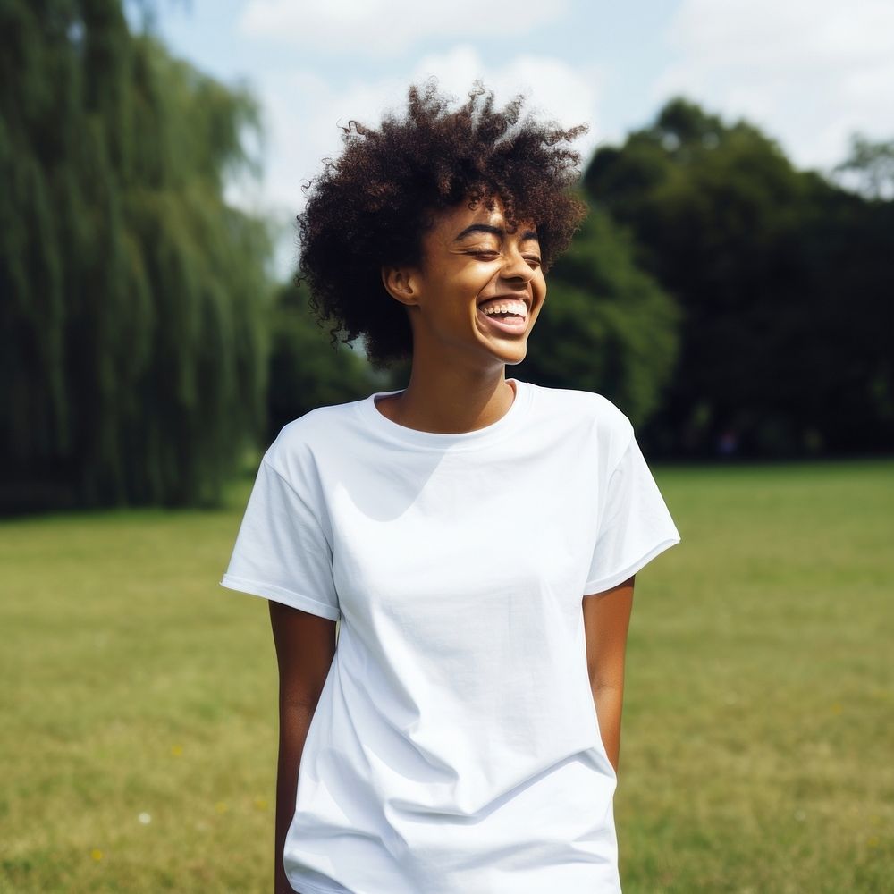 Black woman wearing white over size t-shhirt happy laughing person.
