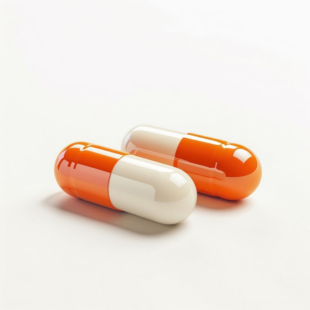 Two orange and white pill capsule medication dynamite.