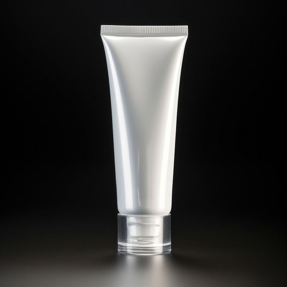 A transparent-opaque toothpaste bottle aftershave cosmetics.