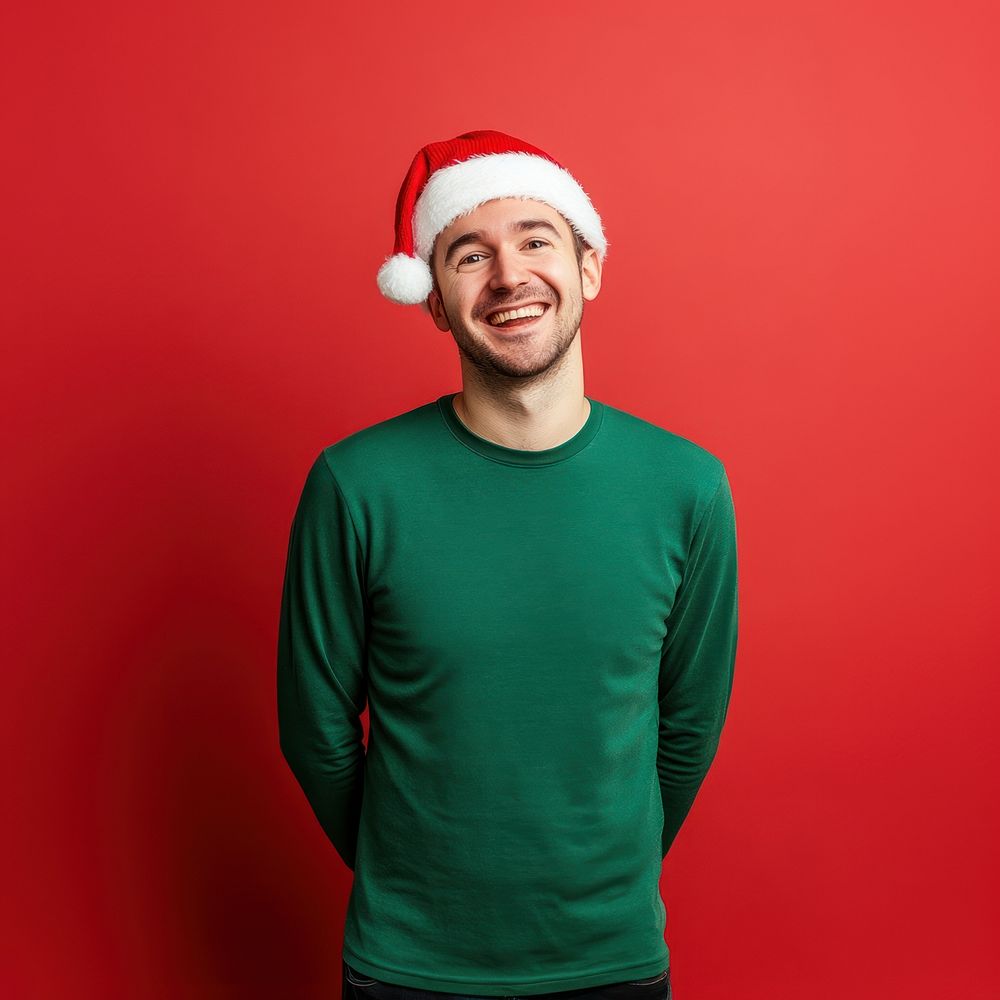 A man wearing christmas hat and green long sleeve photography background portrait.