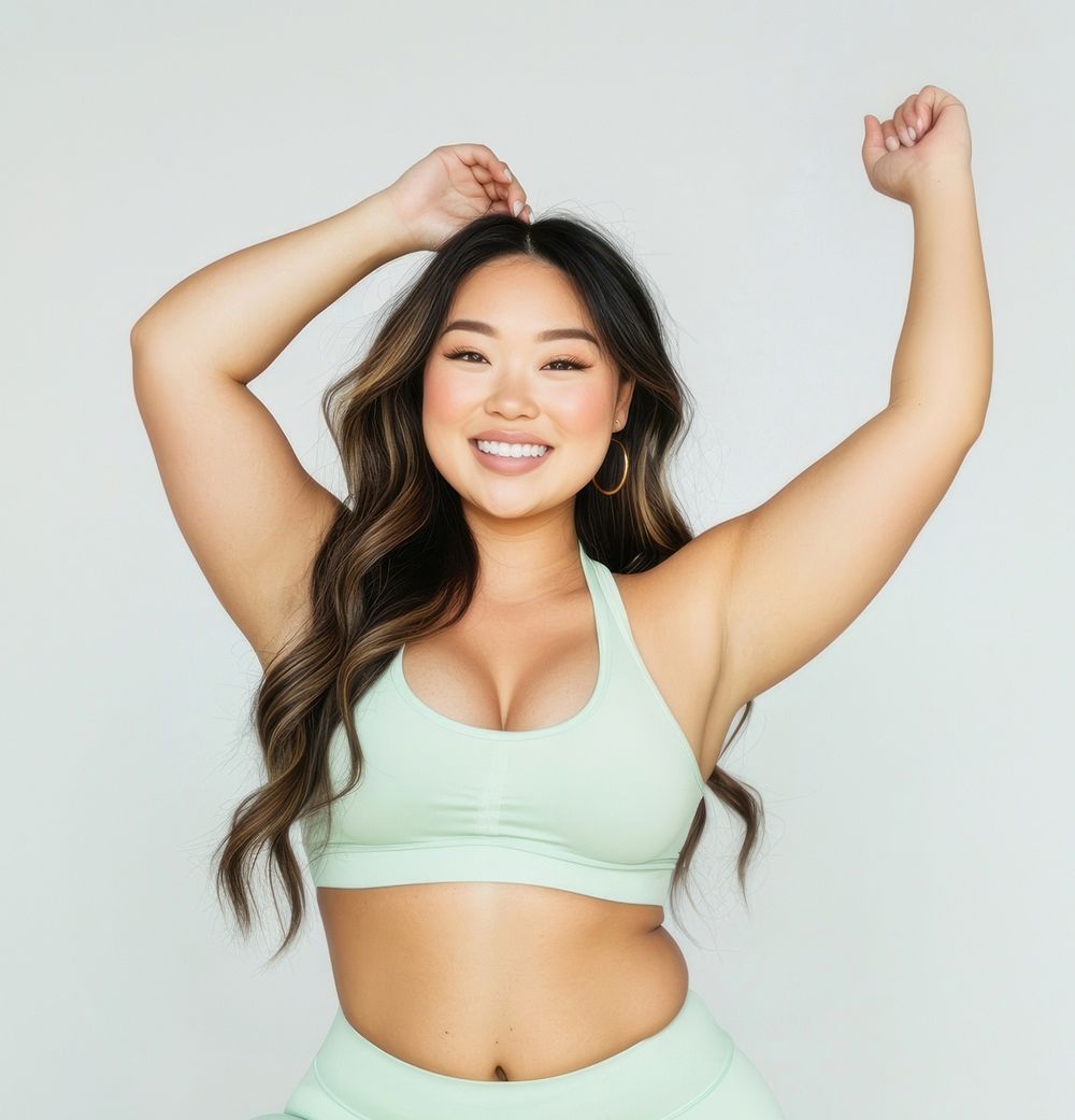 Asian woman wearing yoga pants and smiling fitness happy smile.