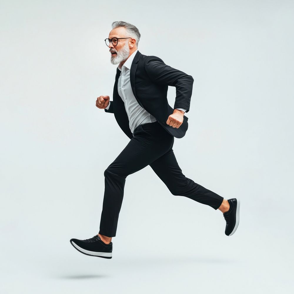 Mature businessman running footwear white suit.