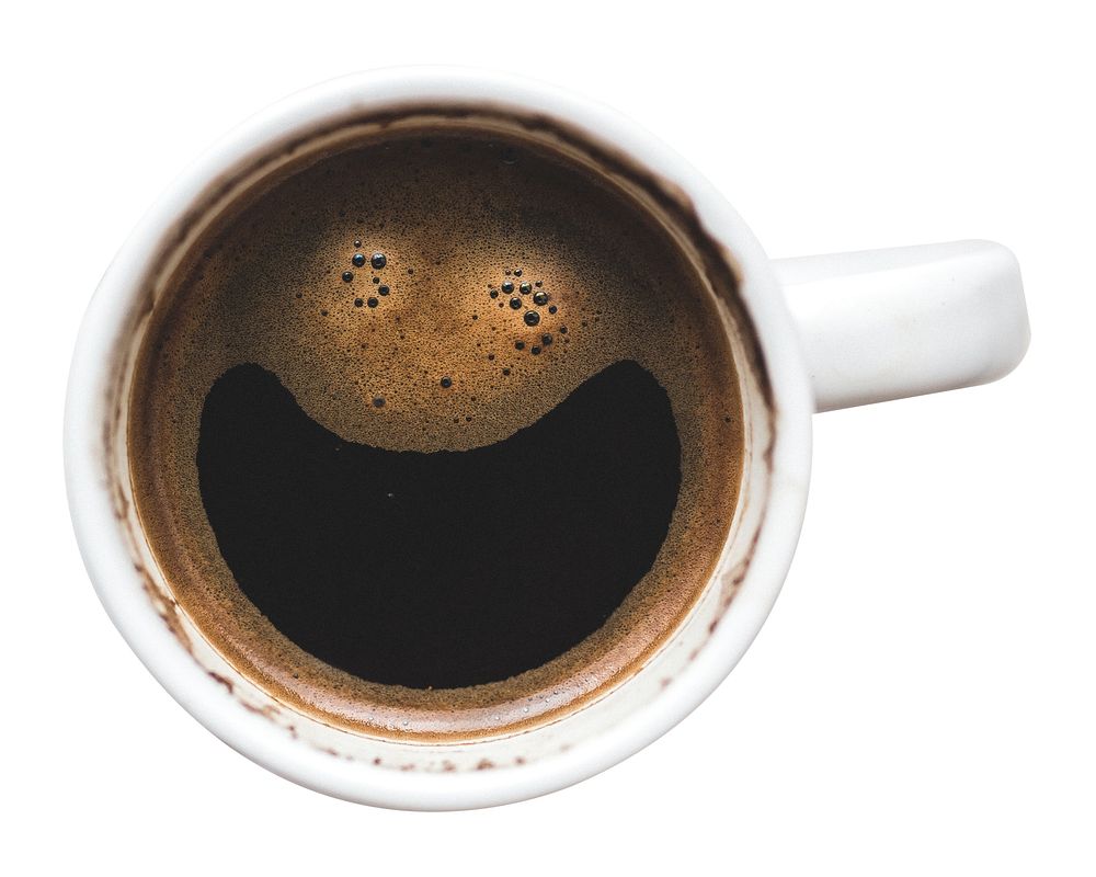 Top view of a coffee cup with a smiley face pattern. Coffee smiley face, coffee art, coffee cup. Enjoy a smiley coffee…