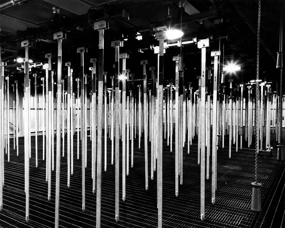 Hangers for buckets holding spent fuel assemblies in the Idaho Chemical Processing Plant fuel storage building canal. Circa…