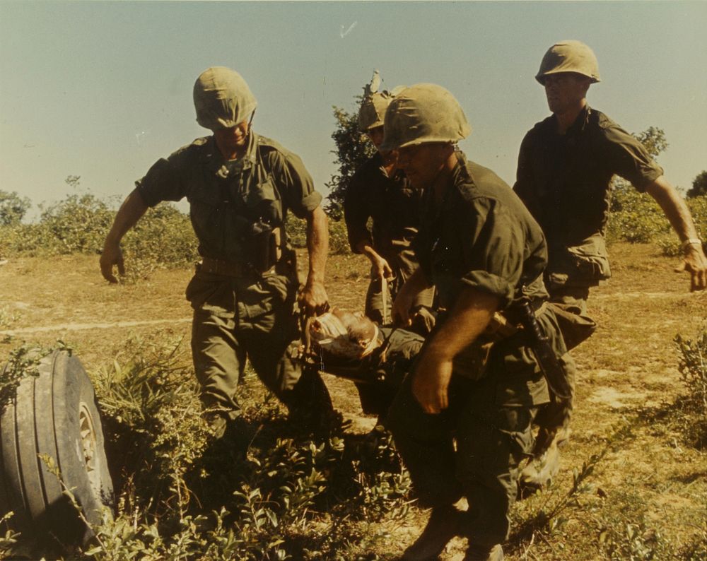 Chu Lai, Vietnam - A wounded Marine is stretchered to a waiting evacuating helicopter. Original public domain image from…