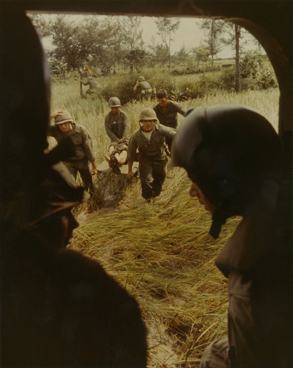 Phu Bai, Vietnam - A battle casualty of the 1st battalion, 4th Marines, is brought to a helicopter for evacuation.