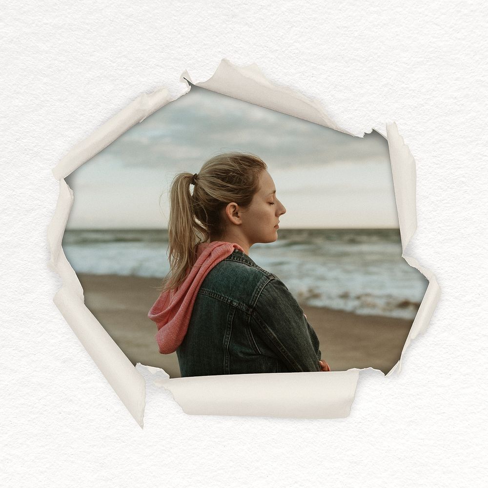 Lonely woman on beach center torn paper shape badge, travel photo