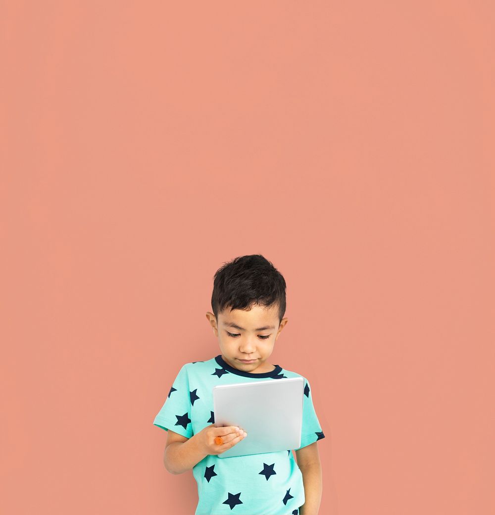 Little boy studio isolated with tablet