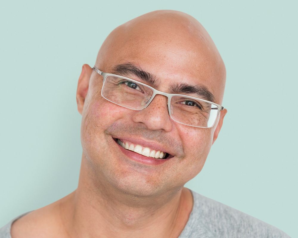 Bald man wearing glasses portrait, smiling face close up