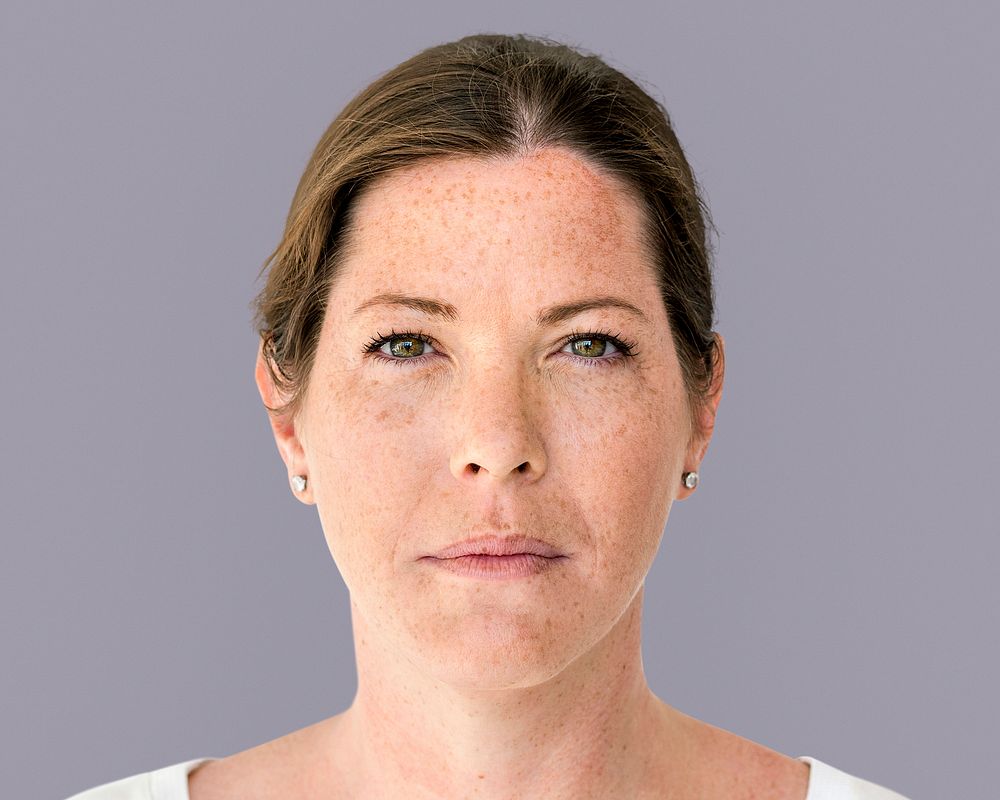 Freckled woman face portrait, natural beauty concept