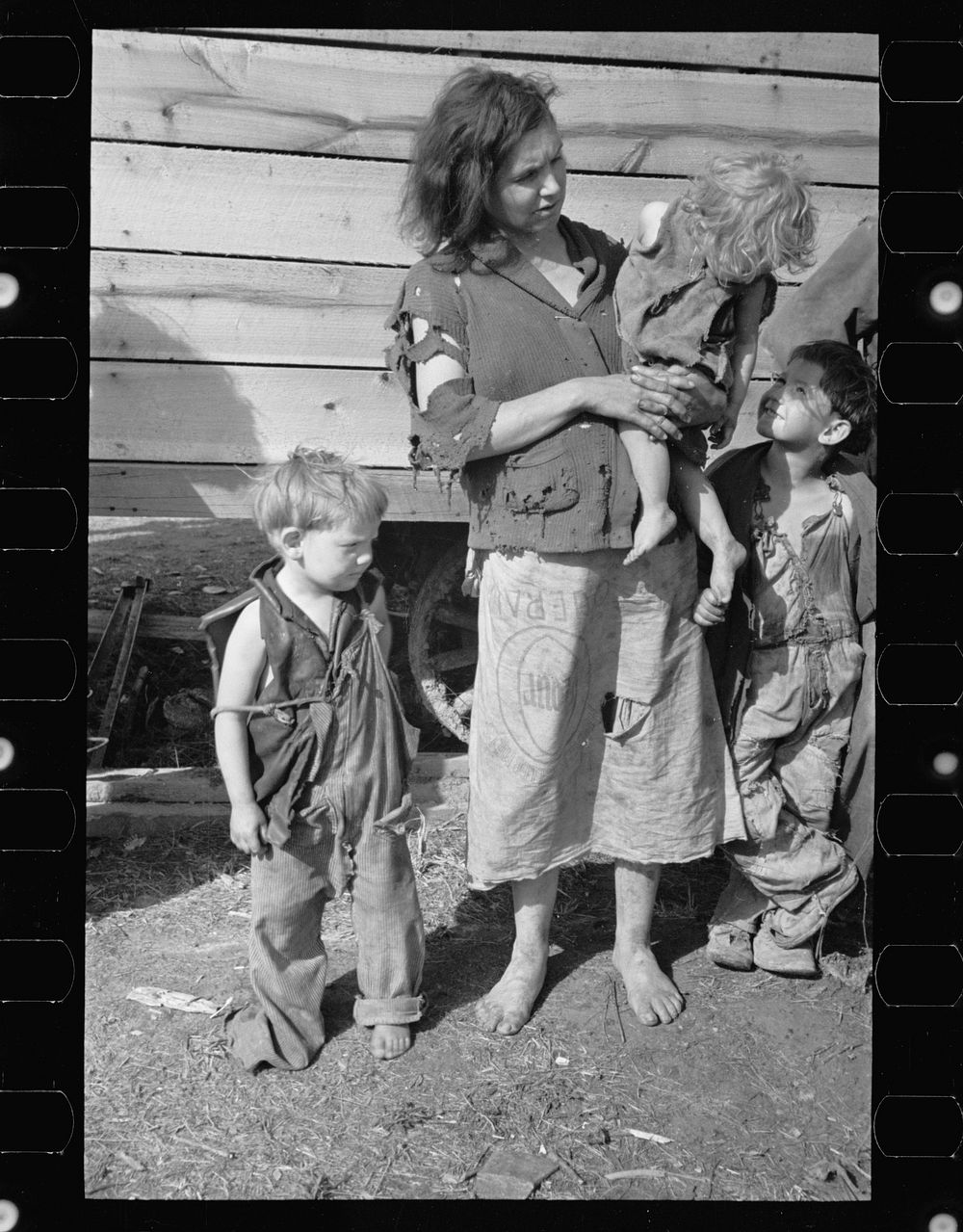 Mother and baby of family of nine living in field on U.S. Route 70 in Tennessee, near Tennessee River. Sourced from the…