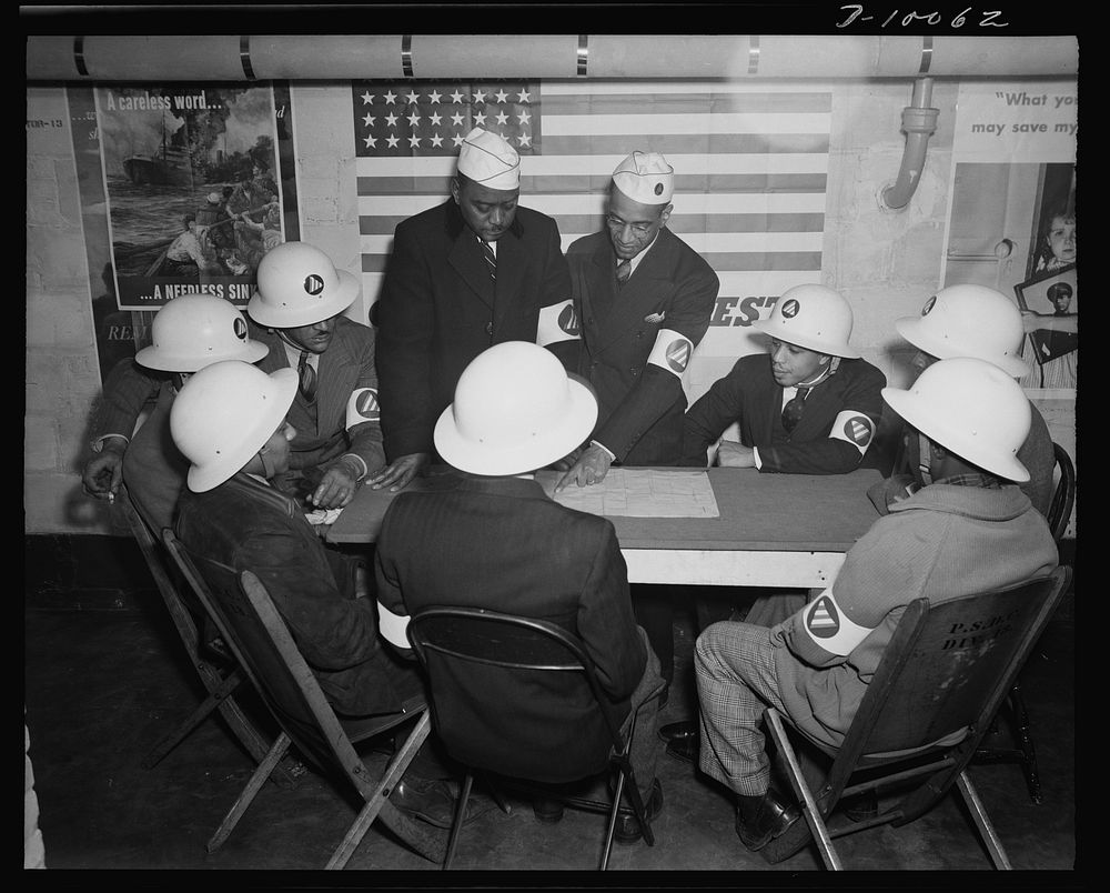 Office of Civilian Defense workers help protect nation's capital. Air raid wardens at a sector meeting in Washington, D.C.…