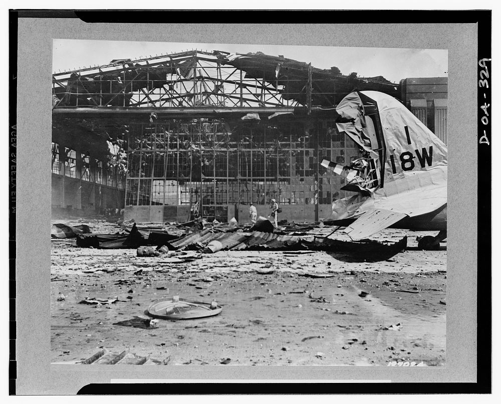 First Army photos of the bombing of Hawaii, December 7, 1941. Rear view of hanger no. 11, Hickam Field. Sourced from the…
