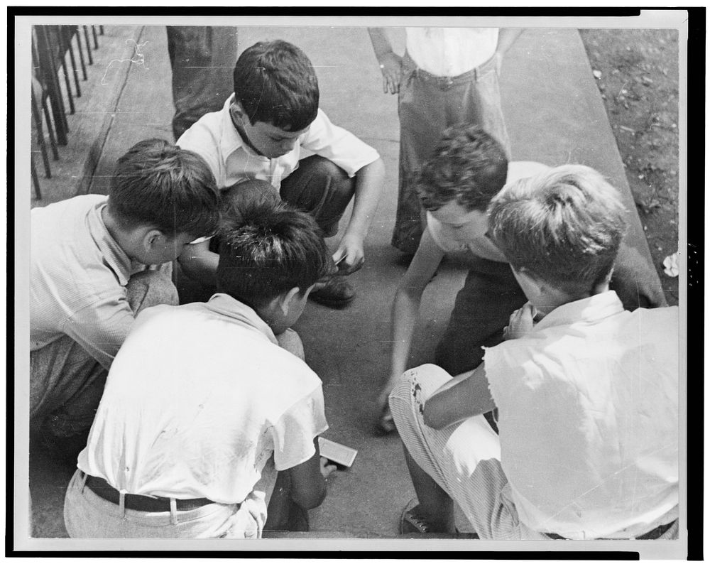 Boys playing cards near Union Station, Washington, D.C.. Sourced from the Library of Congress.