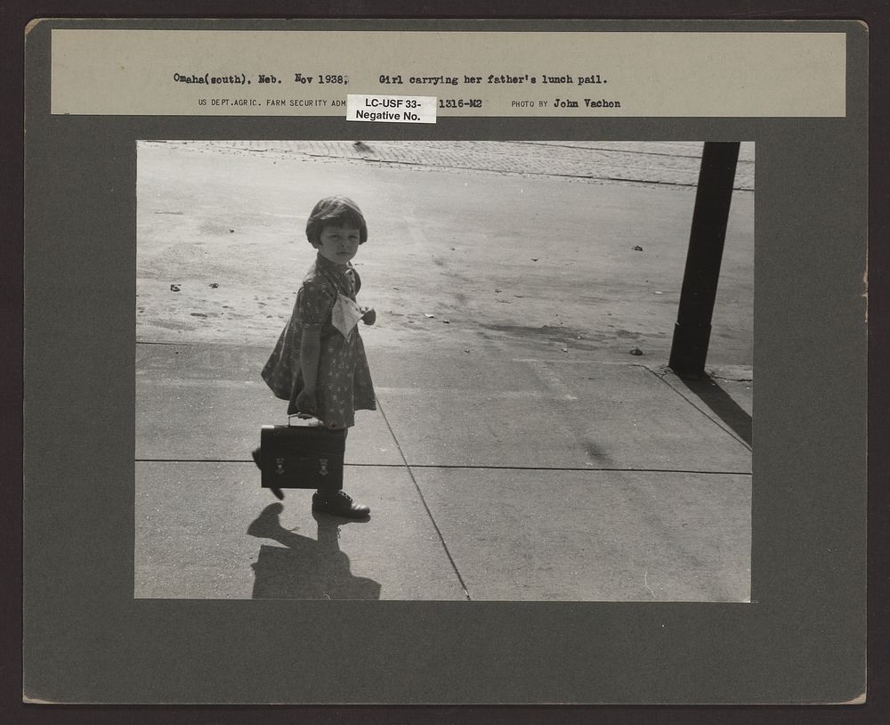 Girl carrying her father's lunch pail, South Omaha, Nebraska. Sourced from the Library of Congress.