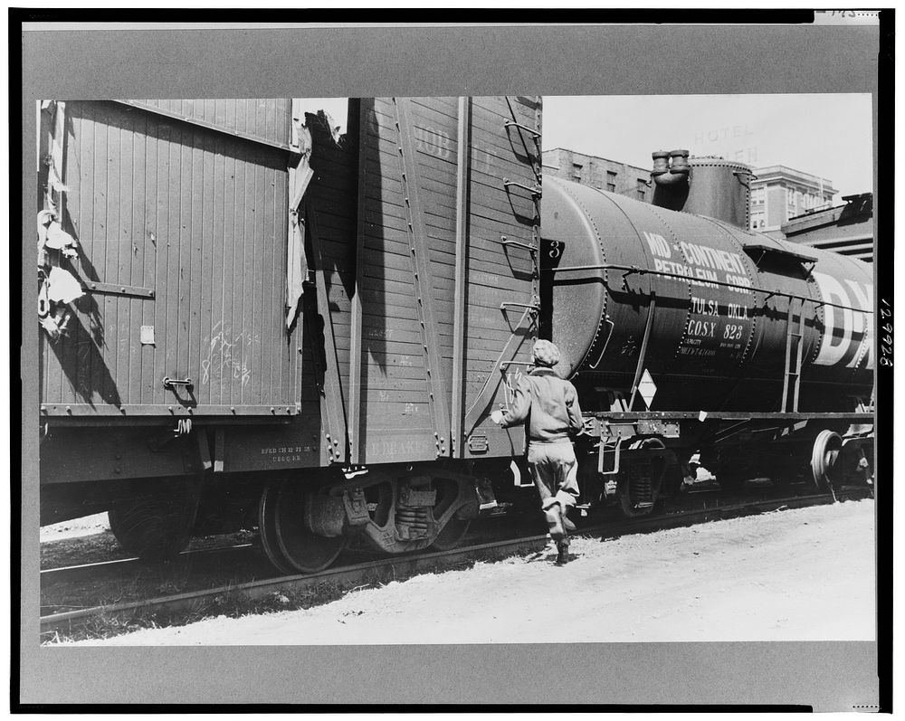 Boy hopping freight train, Dubuque, Iowa. Sourced from the Library of Congress.