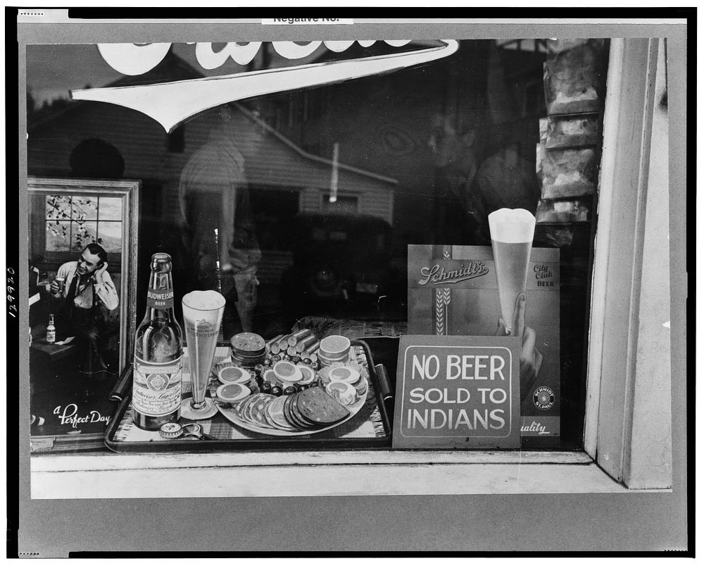 Sign in beer parlor window, Sisseton, South Dakota. Sourced from the Library of Congress.
