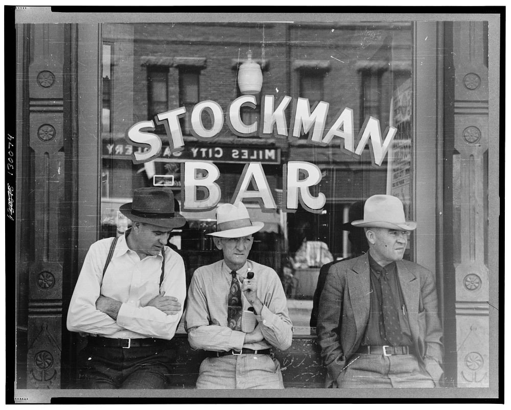 Miles City, Montana. Stockmen in front of a bar on main street. Sourced from the Library of Congress.