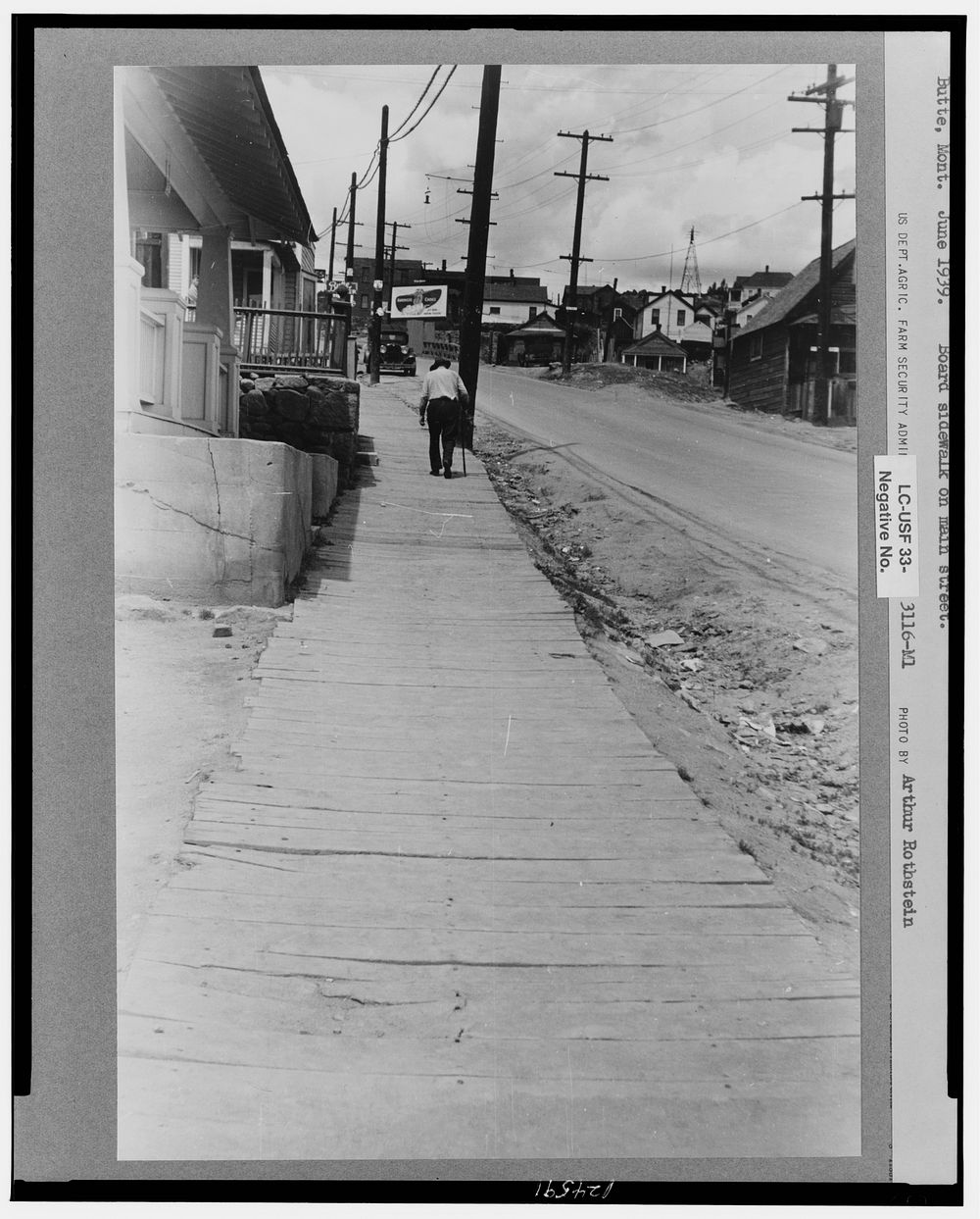 Board sidewalk on main street. Butte, Montana. Sourced from the Library of Congress.