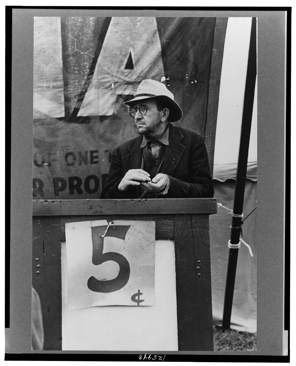 Ticket seller, carnival, Brownsville, Texas. Sourced from the Library of Congress.
