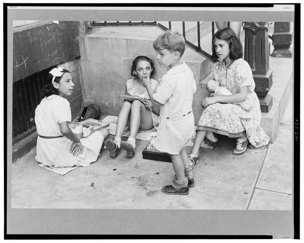 New York, New York. 61st Street between 1st and 3rd Avenues. Children playing in the street. Sourced from the Library of…