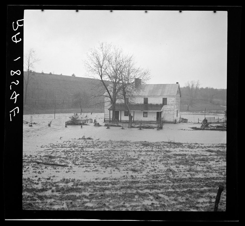 A low-lying farm being slowly engulfed by the rising waters of a West Virginia stream. Sourced from the Library of Congress.