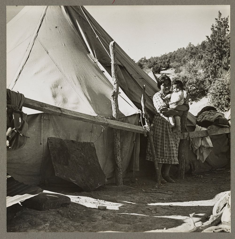 An Indian woman in front of her tepee. Many Indians on the Mescalero Reservation in New Mexico live in such primitive tents.…