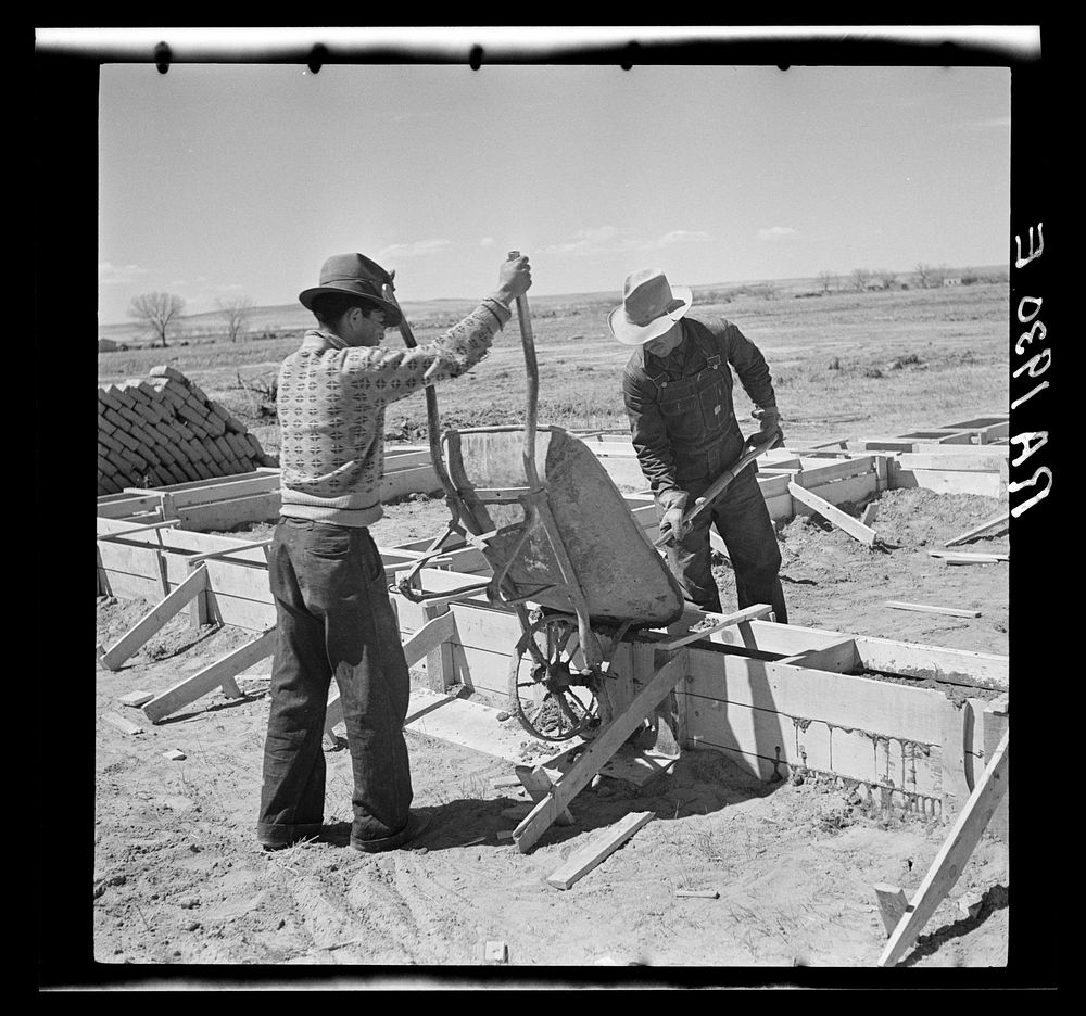 Laying the foundations for one of the adobe houses. Bosque Farms, New Mexico. Sourced from the Library of Congress.