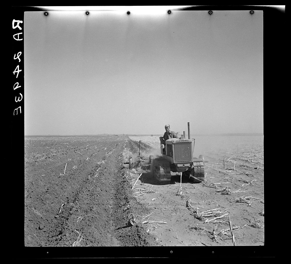 A farmer listing his fields under the wind erosion control program. He receives twenty cents an acre for the work. Liberal…