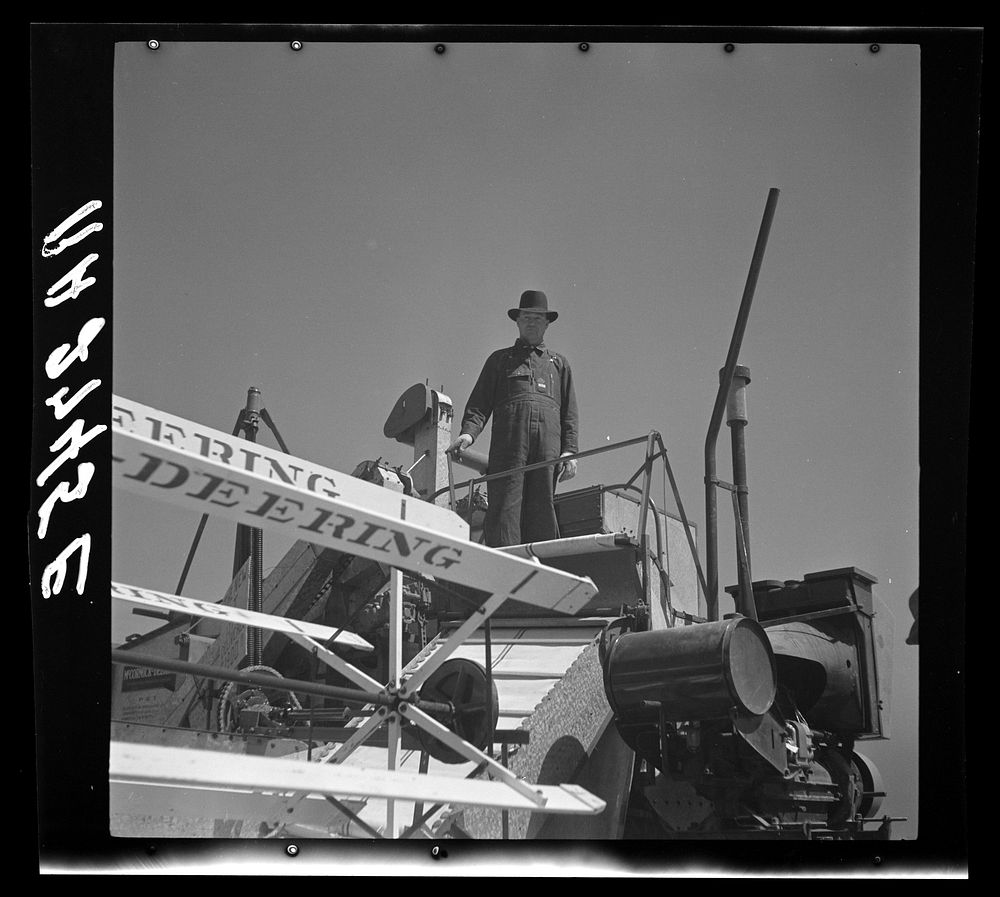 Operating a harvester on a Texas wheat field. Sourced from the Library of Congress.