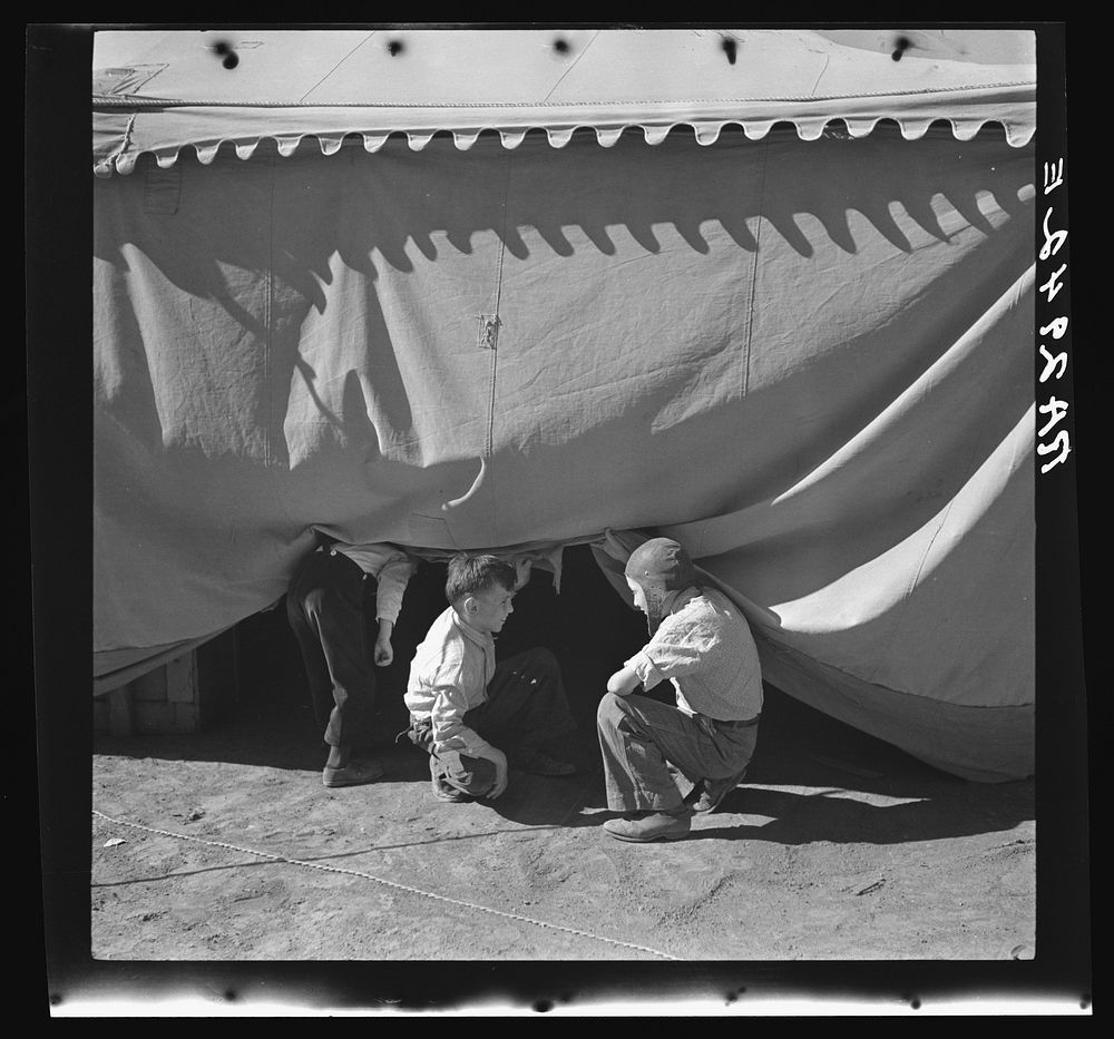 Sneaking under the circus tent. Roswell, New Mexico. Sourced from the Library of Congress.
