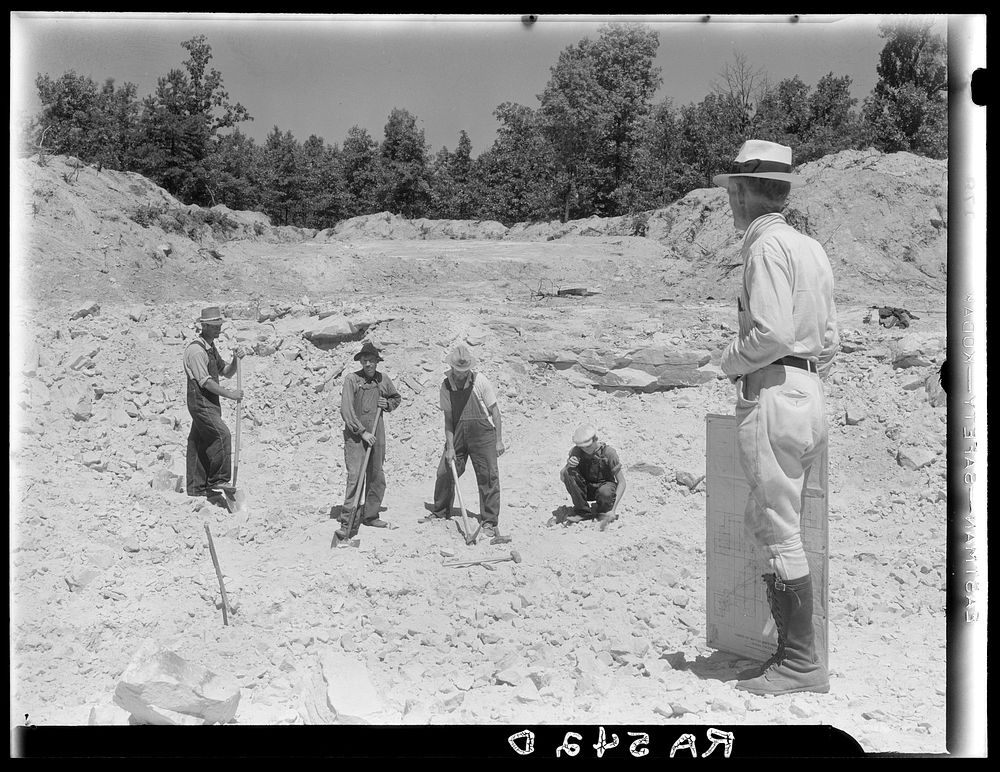 Farmers resettled on Skyline Farms, Alabama, at work in sand quarry under supervision of project manager. Sourced from the…