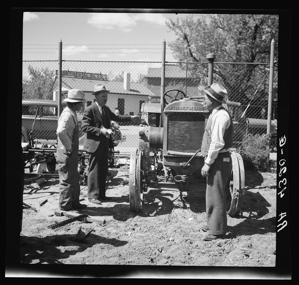 Rehabilitation client is advised in purchase of tractor by county supervisor. Alliance, Nebraska. Sourced from the Library…