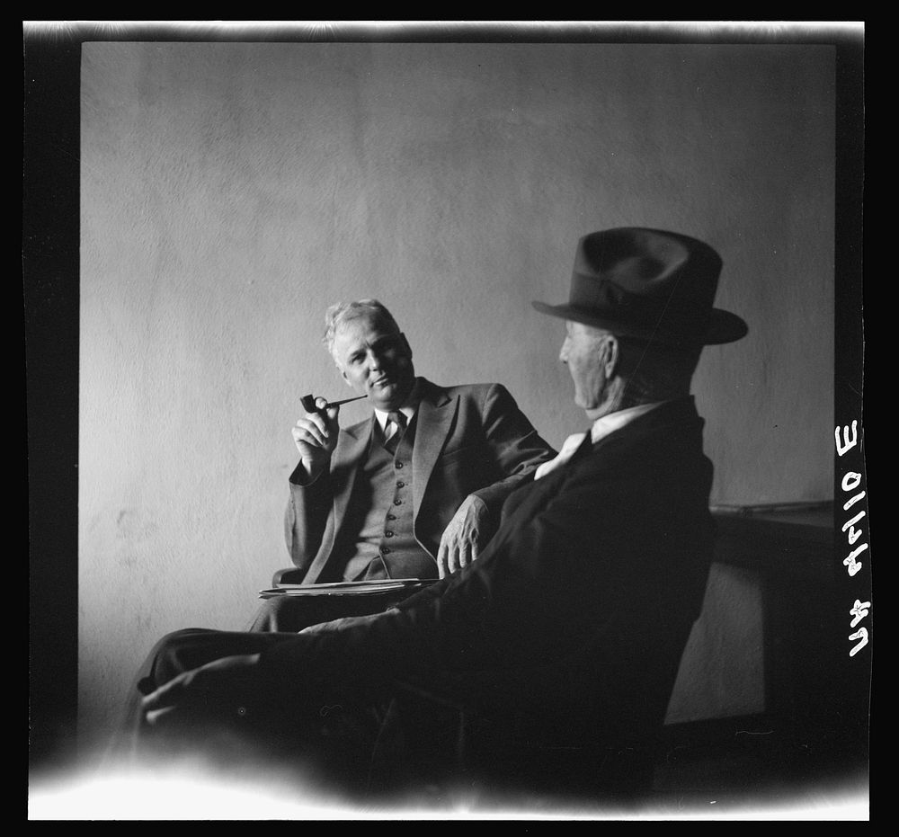 Supervisor conferring with farmer. Falls City, Nebraska. Sourced from the Library of Congress.