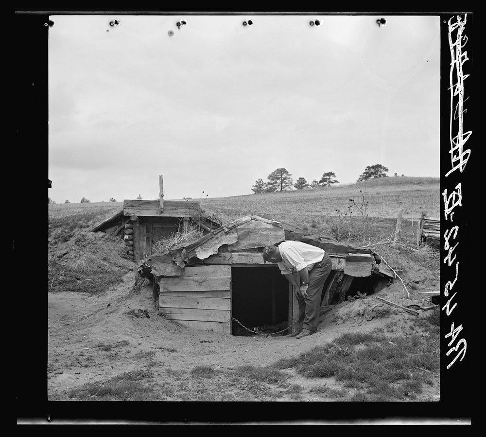 New storage dugout built by rehabilitation client. Old one in foreground. Sioux County, Nebraska. Sourced from the Library…