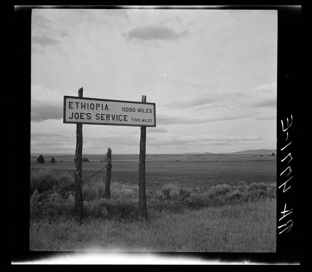 Sign on highway near Madras, Oregon. Sourced from the Library of Congress.