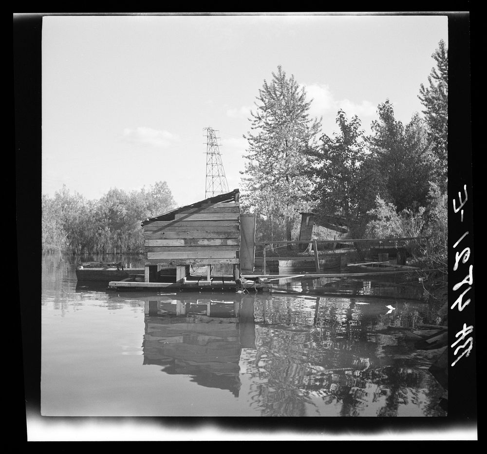 Privy floating in Willamette River. Squatters. Hooverville, Portland, Oregon. Sourced from the Library of Congress.