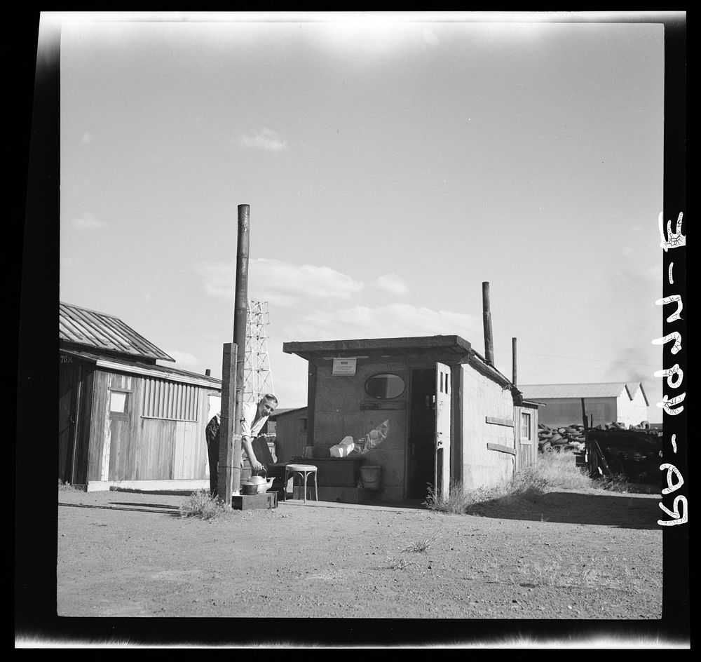 Hooverville shack with outdoor store. This man obtains seasonal employment in the Yakima and Willamette fruit orchards.…