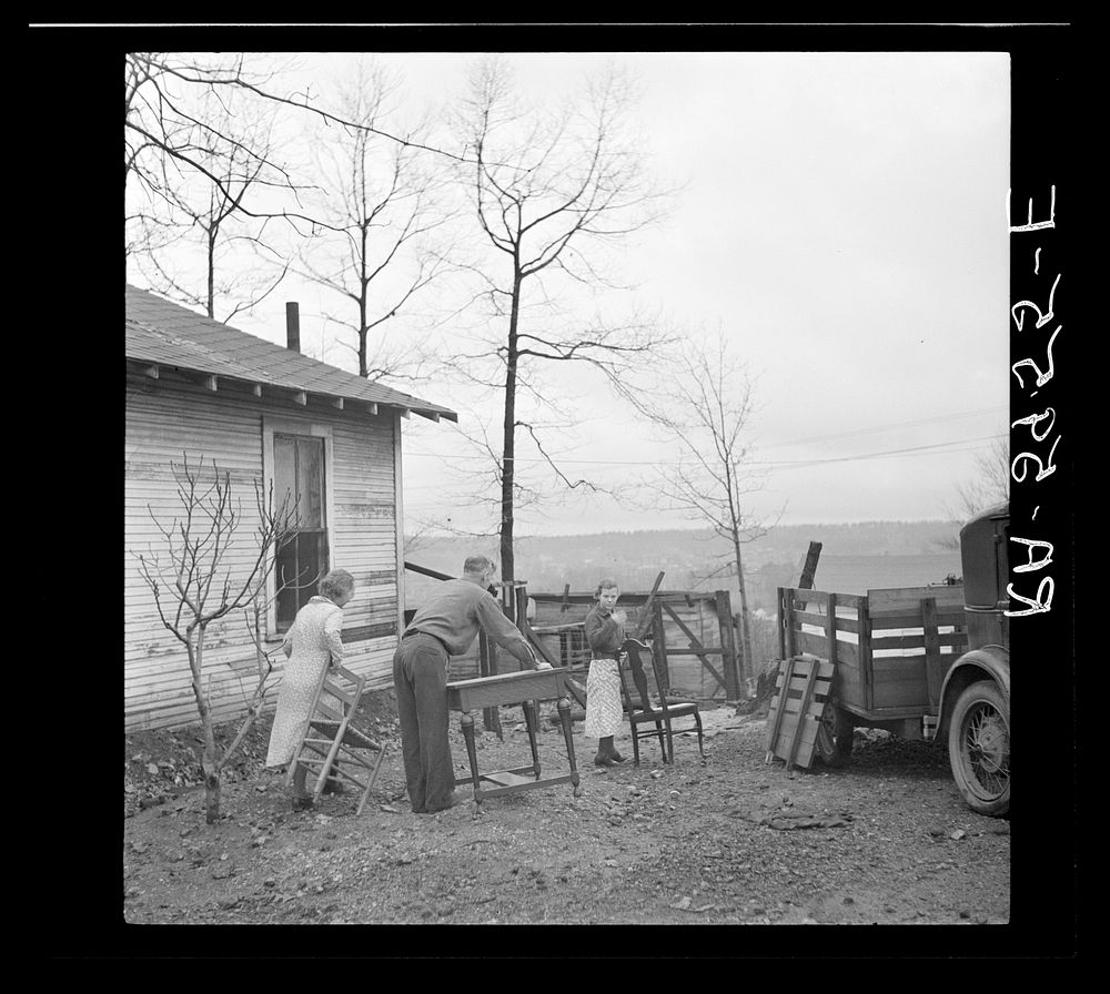 The Eargle Family moving their household goods out of their home at Fairfield, Alabama. They will become homesteaders at…
