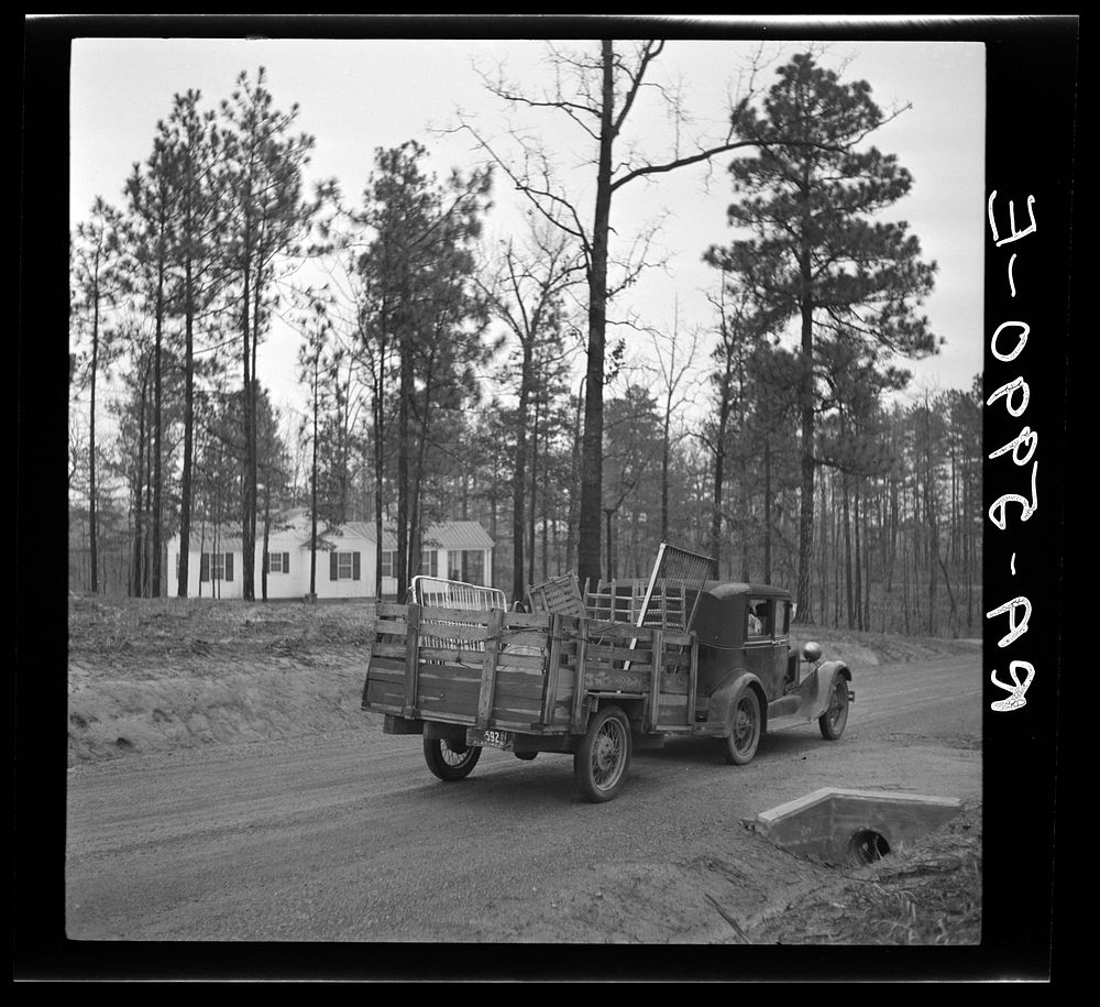 Mr. Eargle, with household in trailer, drives into Gardendale Homesteads, Alabama. Sourced from the Library of Congress.