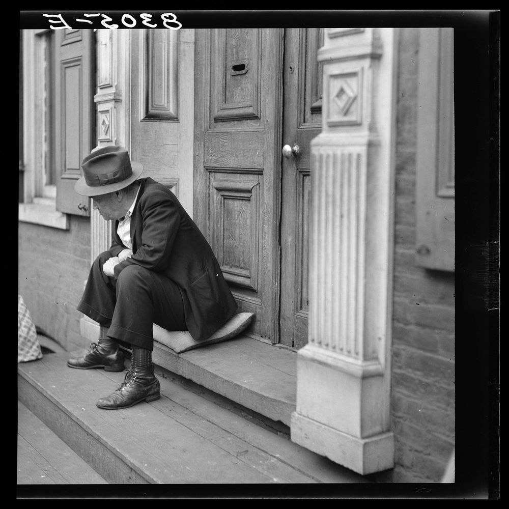 Man on doorstoop. Hagerstown, Maryland. Sourced from the Library of Congress.