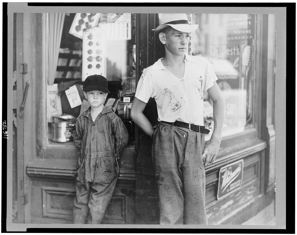 Boys in front of drugstore. Dover, Delaware. Sourced from the Library of Congress.