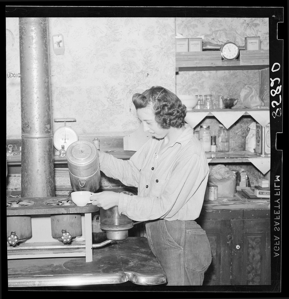 Girl striker in kitchen of house occupied by thirty-five people. King Farm near Morrisville, Pennsylvania. Sourced from the…