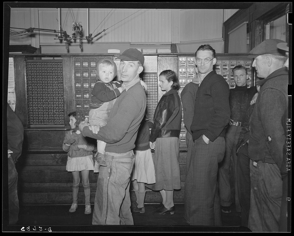 Miners waiting in post office for mail. Kempton, West Virginia. Sourced from the Library of Congress.