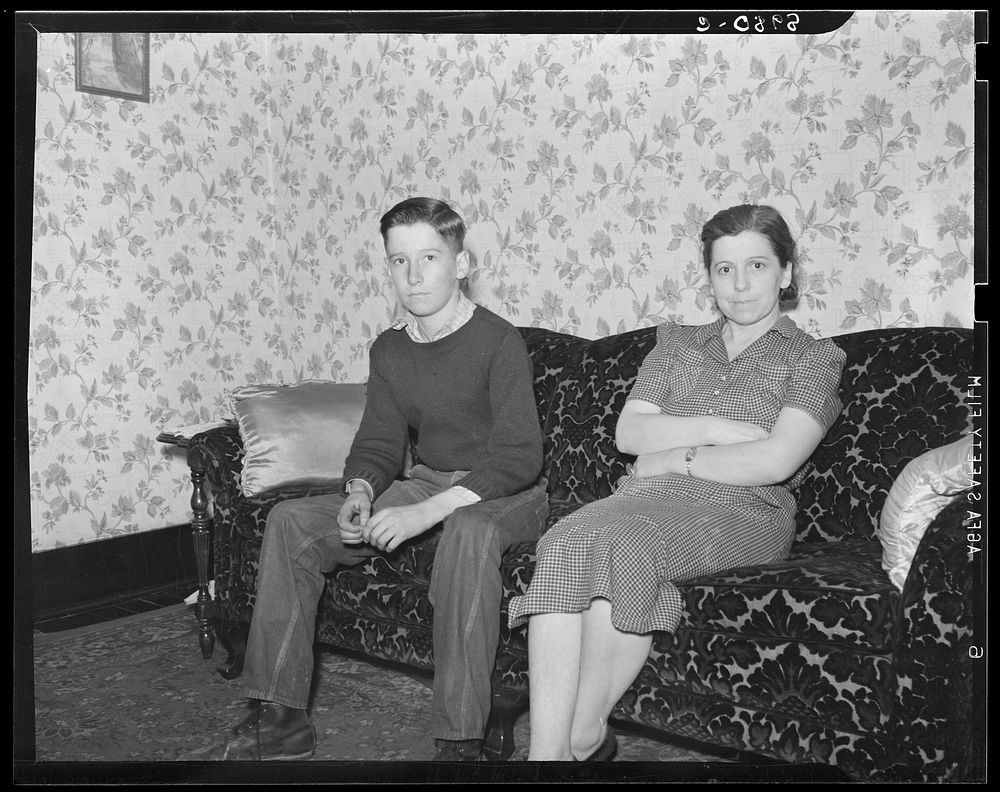 Wife and son of coal miner in their home. Kempton, West Virginia. Sourced from the Library of Congress.