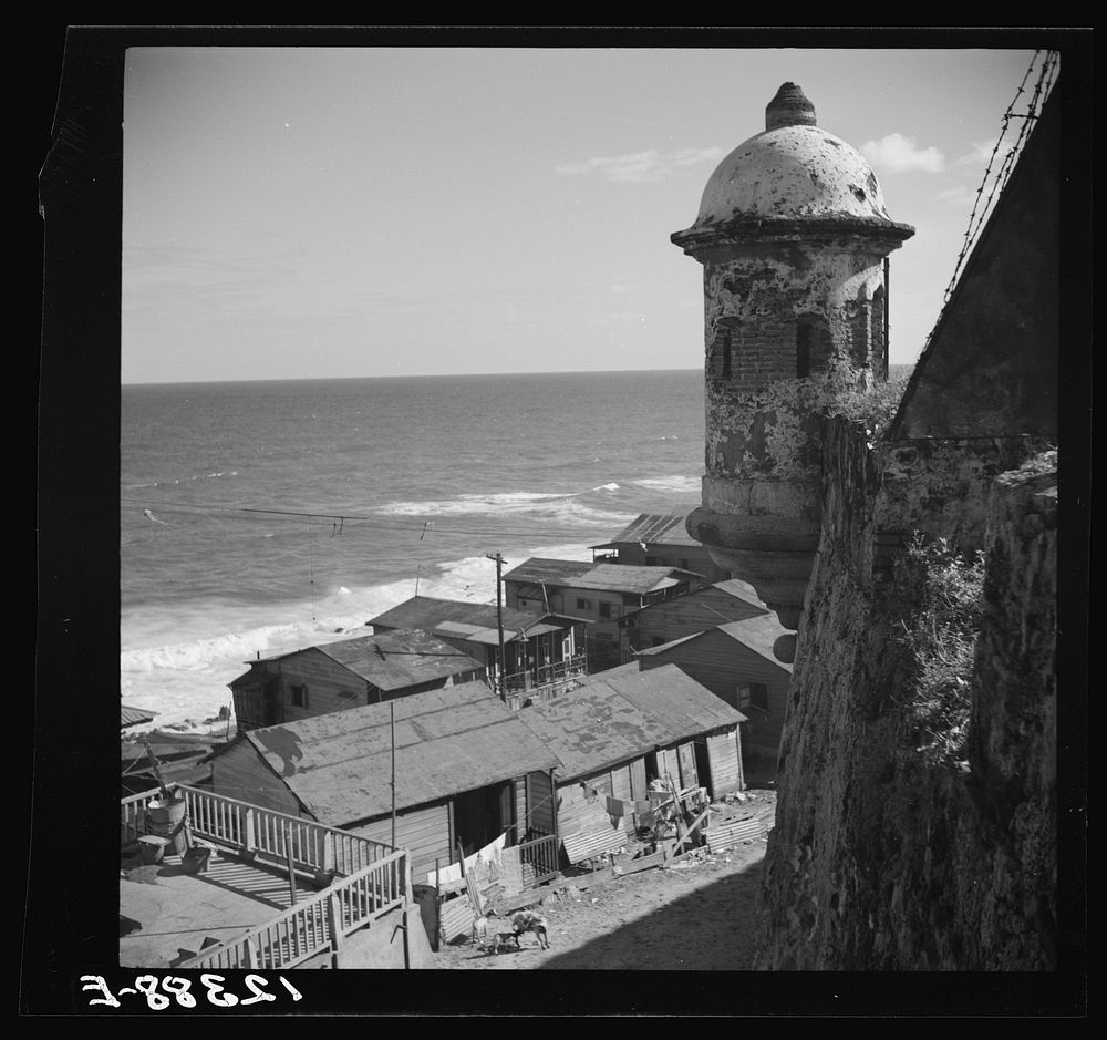 View of a portion of the workers' quarter of La Perla from the old Spanish ramparts. San Juan, Puerto Rico. Sourced from the…