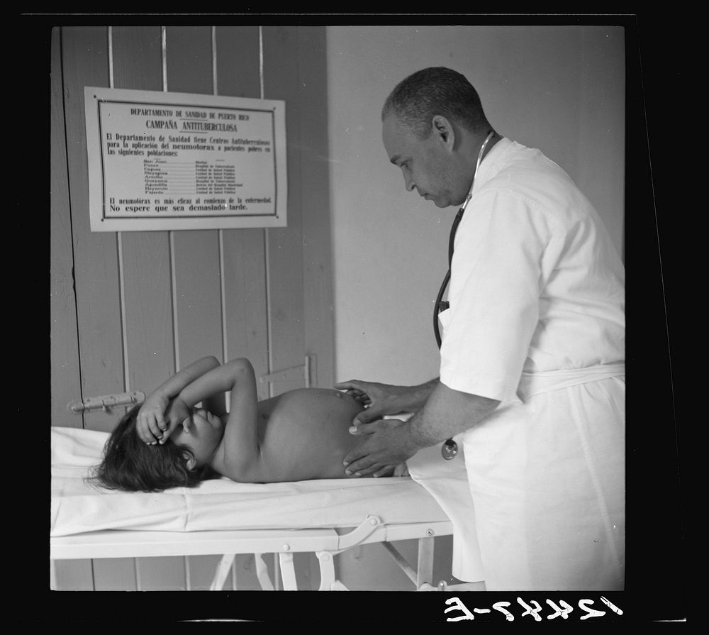 Examination of a child for hookworm in a P.R.R.A (Puerto Rico Resettlement Administration) center, San Juan, Puerto Rico.…