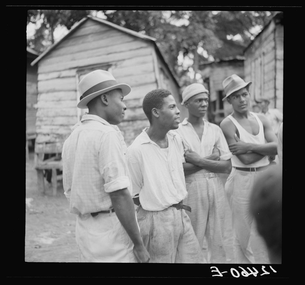  sugar workers in front of their homes near Ponce, Puerto Rico. Sourced from the Library of Congress.